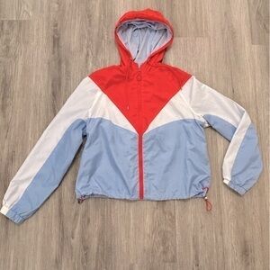 Lightweight women’s hooded jacket coat with drawstrings around bottom hem.